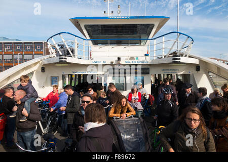 GVB Ferry / Free passenger ferry boat crosses River IJ between Amsterdam Central Station & Buiksloterweg in Dutch capital Netherlands Holland Stock Photo