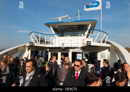 GVB Ferry / Free passenger ferry boat crosses River IJ between Amsterdam Central Station & Buiksloterweg in Dutch capital Netherlands Holland Stock Photo