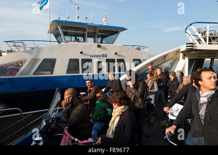 GVB Ferry / Free passenger ferry boat crosses River IJ between Amsterdam Central Station & Buiksloterweg in Dutch capital Netherlands Holland Stock Photo