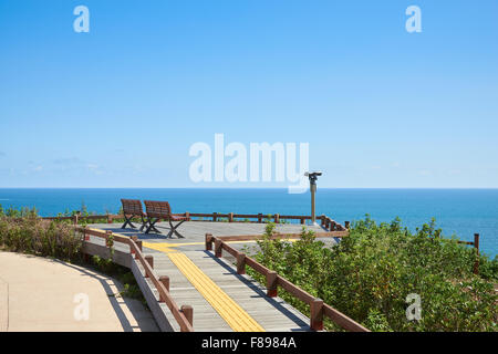 two benches and binoculars at the obserbatory in Oryukdo Park in Busan, Korea. Stock Photo