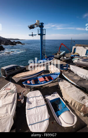 Fishing boats in the dry dock at the port in Puerto santiago, Tenerife, Canary Islands, Spain, Stock Photo