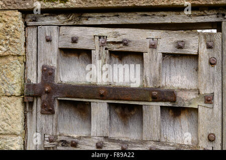 Detail of hinges on a weathered, old door Stock Photo