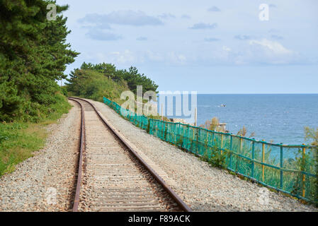 old rusty railroad in Busan, Korea.  The train tracks between Haeundae and Songjeong (part of Donghae Namu line) were abandoned Stock Photo