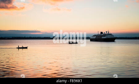 Boats on the Porto Grande, Ortigia, Syracuse, Sicily at sunset Stock Photo