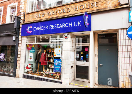 Cancer Research UK Charity Shop store front sign name exterior building entrance Lincoln City UK England Stock Photo