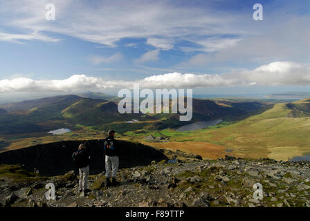 View west from SNOWDON summit in the Snowdonia National Park, showing lakes, rolling hills and mountains Gwynedd, North Wales,UK. Stock Photo