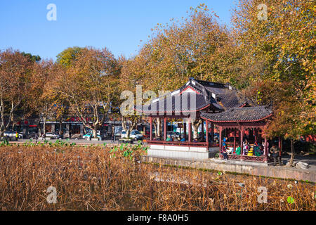 Hangzhou, China - December 5, 2014: Wooden traditional Chinese Gazebo on the coast of West Lake, popular park in Hangzhou city c Stock Photo