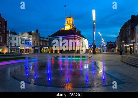 A view at dusk at Christmas of the Town Hall on the High Street in Stockton on Tees seen through the illuminated water fountain Stock Photo