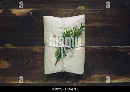 Wrapped gift with fur-tree branch Stock Photo