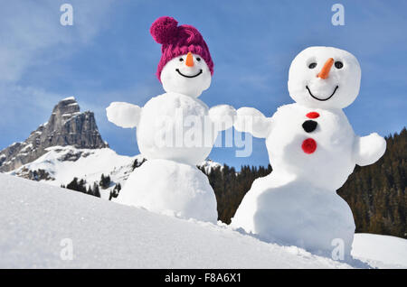 Snowman against Alpine panorama Stock Photo - Alamy