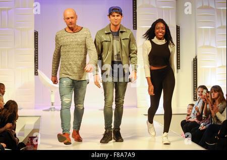 Joey Essex on the catwalk with two audience members at Clothes Show Live, NEC, Birmingham, UK, 7th December 2015. Joey wears items from his own Fusey fashion range. Credit:  Antony Nettle/Alamy Live News Stock Photo