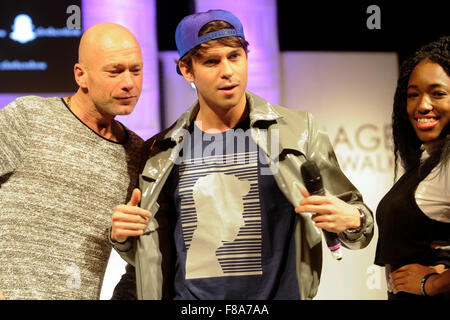 Joey Essex on the catwalk with two audience members at Clothes Show Live, NEC, Birmingham, UK, 7th December 2015. Joey wears items from his own Fusey fashion range. Credit:  Antony Nettle/Alamy Live News Stock Photo