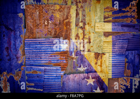 An abstract background image of the flag of Bosnia and Herzegovina painted on to rusty corrugated iron sheets Stock Photo