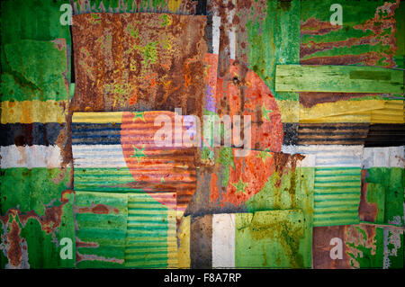 An abstract background image of the flag of Dominica painted on to rusty corrugated iron sheets overlapping to form a wall Stock Photo