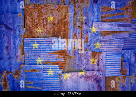 An abstract background image of the flag of European Union painted on to rusty corrugated iron sheets overlapping to form a wall Stock Photo