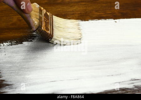 Painting out the wood planks Stock Photo