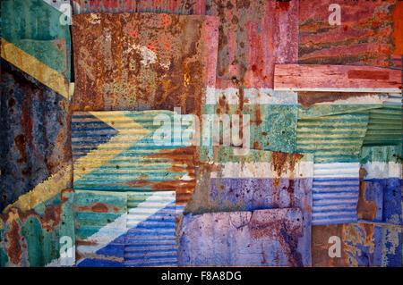 An abstract background image of the flag of South Africa painted on to rusty corrugated iron sheets overlapping to form a wall Stock Photo