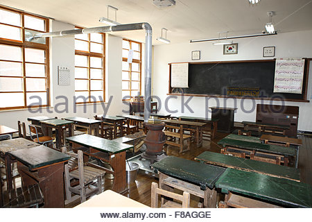 Old school desk and blackboard with abacus in classroom of the early ...