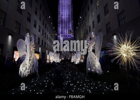 New York, New York, USA. 07th Dec, 2015. Angels and Christmas lights adorn Rockefeller Center in New York City.  The giant Christmas tree is visible in the distance. Credit:  Adam Stoltman/Alamy Live News Stock Photo