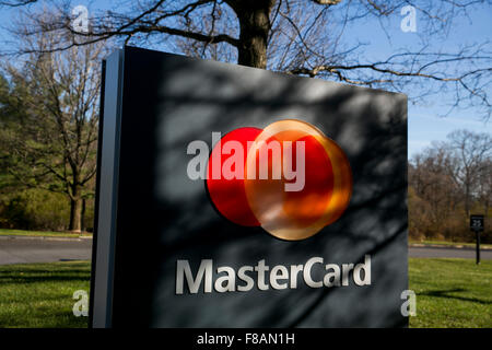 A logo sign outside of the headquarters of MasterCard Worldwide in Purchase, New York on November 21, 2015. Stock Photo