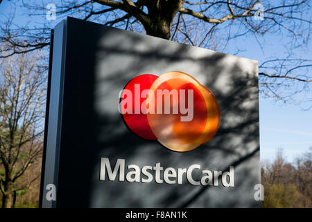 A logo sign outside of the headquarters of MasterCard Worldwide in Purchase, New York on November 21, 2015. Stock Photo