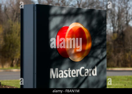 A logo sign outside of the headquarters of MasterCard Worldwide in Purchase, New York on November 21, 2015. Stock Photo