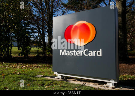 A logo sign outside of the headquarters of MasterCard Worldwide in Purchase, New York on November 21, 2015. Stock Photo