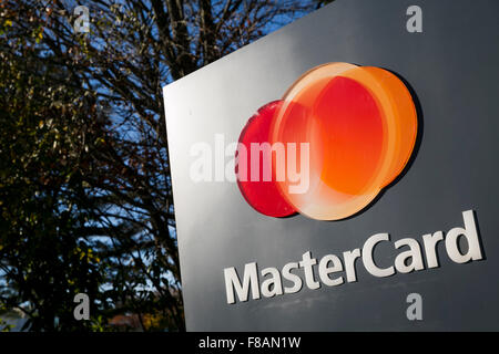 A logo sign outside of the headquarters of MasterCard Worldwide in Purchase, New York on November 21, 2015. Stock Photo