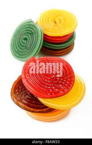 colorful liquorice licorice spiral candies on white background Stock Photo