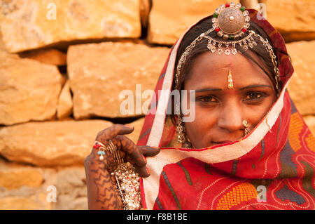 Traditional Indian woman in sari costume covered her face with veil, India Stock Photo