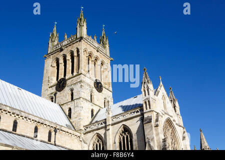 The south side of  Selby Abbey showing the tower against a clear blue sky background Stock Photo