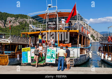 Tourists Disembark At Turunc For The Monday Market Whilst On A Boat Trip Around The Bay, Marmaris, Mugla Province, Turkey Stock Photo