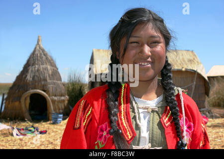 Smiling Uros Indian Girl On Floating Islands, Lake Titicaca, Peru Stock Photo