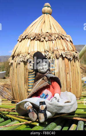 Uros Indian Handicraft Doll Outside A Model Of A Traditional House Stock Photo