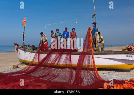 Fishermen stowing their nets Colva Beach Goa India Stock Photo