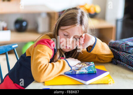 9-year-old girl doing her homework. Stock Photo