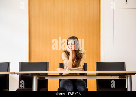 Woman alone in a conference room. Stock Photo