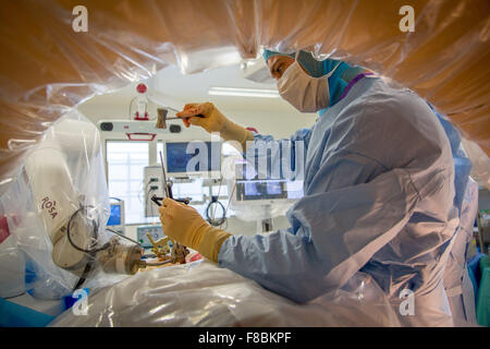 Patient receiving intervertebral disk prosthesis to treat Slipped disc with ROSA Spine ® robot, Amiens hospital, France. Stock Photo