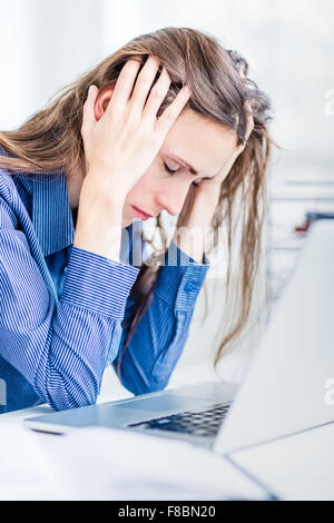 Tired woman at work. Stock Photo