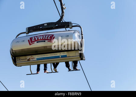 People on Butorowy Wierch Chairlift seen from below. Gubalowka Mountain, Zakopane, Tatra County, Poland Stock Photo