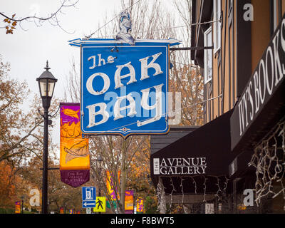 A view of the Oak Bay Theatre neon sign, in the historic Castle Block on Oak Bay Avenue in Oak Bay Village, Victoria, Canada. Stock Photo