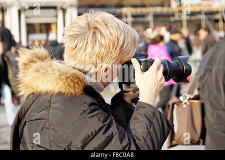 close up of female photographer at the park Stock Photo