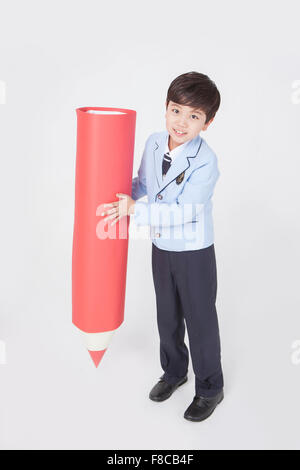 Cute boy of school age lifting barbell above head Stock Photo - Alamy
