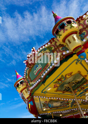 View of traditional fairground carousel or merry go round at an amusement park on the Isle of Wight England UK Stock Photo