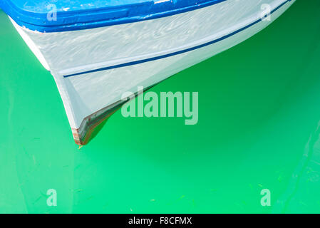 Fishing boat Mediterranean sea, detail of the bow of a fishing boat moored alongside the quay in Catania harbour, Sicily. Stock Photo