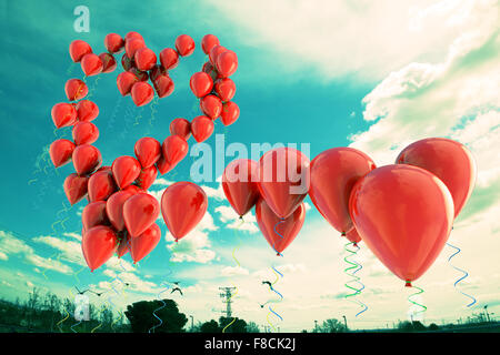 Balloons floating in the sky with heart shape Stock Photo - Alamy