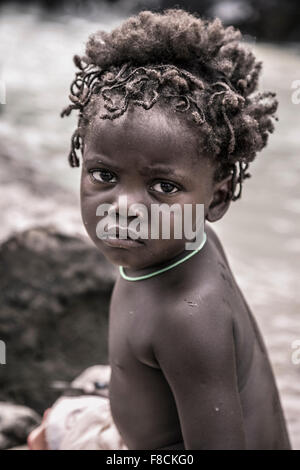 Portrait of a young kid from the Himba tribe, Namibia Stock Photo