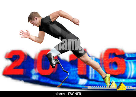Male athlete starts between motion blurred 2016 date out of the blocks. Stock Photo