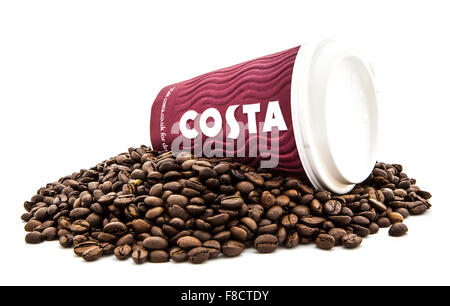 Costa Coffee take a way cup on a bed of fresh coffee beans. Stock Photo