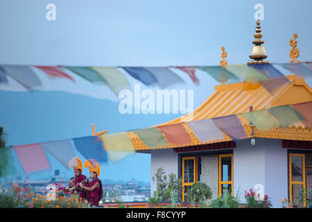 Musician-monks playing flutes in Kathmandu at dust Stock Photo